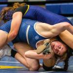 Arlington’s Danielle Crew wrestles during a wrestling scramble at Everett High School on Wednesday, Dec. 13, 2023 in Everett, Washington. (Olivia Vanni / The Herald)