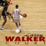 Everett Community Colleges Ethan Martin (1) dribbles near his grandfathers name during a game against Tacoma on Dec. 9 at Everett Community College in Everett. (Annie Barker / The Herald)