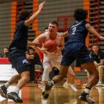 Everett Community Colleges Ethan Martin (1) moves with the ball during a game against Tacoma on Dec. 9 at Everett Community College in Everett. (Annie Barker / The Herald)