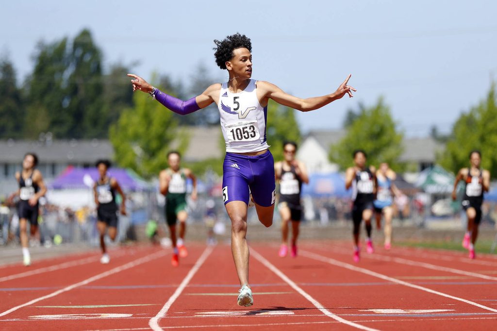 Ryan Berry / The Herald
Lake Stevens senior Grant Buckmiller throws his hands up as he wins the 4A boys 400-meter dash by more than three seconds at the WIAA State Track and Field Championships on May 27 in Tacoma.