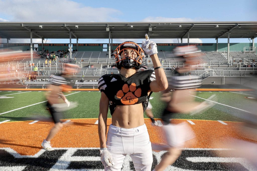 Sophomore wide receiver and free safety Gino Howard (20) poses for a portrait between practicing drills at Granite Falls High School on Wednesday, Oct. 11, 2023, in Granite Falls, Washington. (Annie Barker / The Herald)