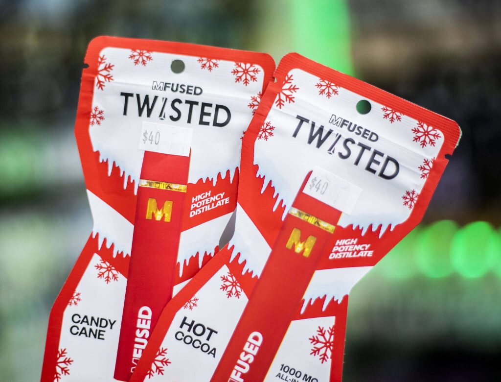 Candy Cane and Hot Cocoa flavored THC vape pens avlaible at The Kushery on Friday, Dec. 15, 2023 in Everett, Washington. (Olivia Vanni / The Herald)
