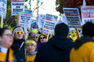 Providence nurses picket in front of the hospital during the first day of their planned 5-day strike Tuesday, Nov. 14, 2023, at Providence Regional Medical Center in Everett, Washington. (Ryan Berry / The Herald)