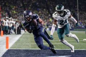 Seattle Seahawks wide receiver Jaxon Smith-Njigba, left, catches the game-winning touchdown in front of Philadelphia Eagles cornerback James Bradberry (24) on Monday in Seattle. (AP Photo/Lindsey Wasson)