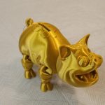 A 3D printed piggy bank, created by Gray Matter and available at Whidbey Island Crafters Market Studios, along with other 3D printed sculptures. (Photo by Luisa Loi)