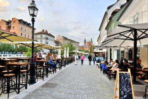 Ljubljana’s riverfront promenade is lined with quaint boutiques, great restaurants, and cafés ripe for people-watching.  (Cameron Hewitt / Rick Steves' Europe)