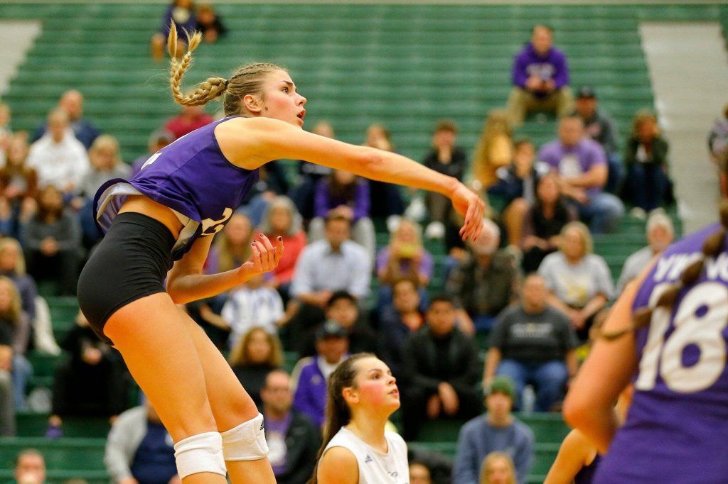 Lake Stevens Laura Eichert records a kill against North Creek during the bi-district tournament championship match Nov. 11 at Henry M. Jackson High School in Mill Creek. (Ryan Berry / The Herald)