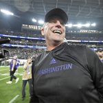 FILE - Washington coach Kalen DeBoer smiles after the team's victory over Oregon in the Pac-12 championship NCAA college football game, Dec. 1, 2023, in Las Vegas. DeBoer has made a rapid rise through the coaching ranks. He won three NAIA national championships as head coach at the University of Sioux Falls from 2005-09 and had five coaching stops in 12 years before landing at Washington. (AP Photo/David Becker, File)