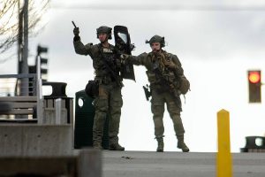 Law enforcement in heavy gear operate outside the Snohomish County Superior Courthouse during a lockdown Monday, Dec. 12, 2022, in downtown Everett, Washington. (Ryan Berry / The Herald)