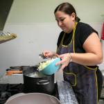 Ivanna Tomashevska slowly adds cabbage to a pot of borscht. Tomashevaska, a native of Ukraine, moved to Washington with her husband and two daughters in 2023 after living in Poland for three years. (Ryan Berry / The Herald)