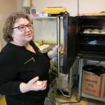 Olga Gershaft, who owns European Deli Svitlana with her family, walks through the bakery in the back of the restaurant. (Ryan Berry / The Herald)