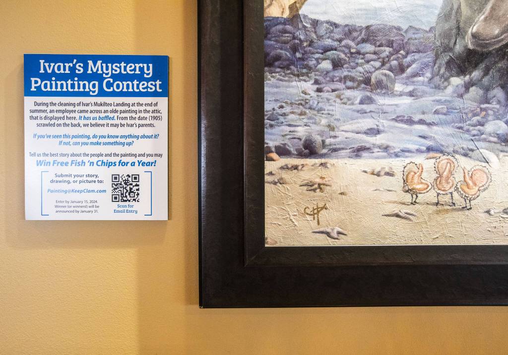 Clams spell out letters of the artists signature on the Ivars Mystery Painting on Thursday, Dec. 14, 2023 in Mukilteo, Washington. (Olivia Vanni / The Herald)