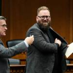 Sen. Marko Liias, D-Edmonds, chair of the Senate Transportation Committee, at right, looks over at Sen. Curtis King, R-Yakima, ranking minority member of Senate Transportation Committee, at left, after participating in a panel during a legislative session preview in the Cherberg Building at the Capitol, Thursday, Jan. 4, 2024 in Olympia, Washington. (AP Photo/Lindsey Wasson)