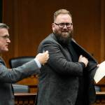 Sen. Marko Liias, D-Edmonds, chair of the Senate Transportation Committee, at right, looks over at Sen. Curtis King, R-Yakima, ranking minority member of Senate Transportation Committee, at left, after participating in a panel during a legislative session preview in the Cherberg Building at the Capitol, Thursday, Jan. 4, 2024 in Olympia, Wash. (AP Photo/Lindsey Wasson)