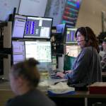 911 Dispatcher Kelly Contreras speaks with a caller while working at the Snohomish County 911 dispatch center Thursday, Jan. 18, 2024, in Everett, Washington. (Ryan Berry / The Herald)
