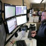 Patrick Hunstiger, a dispatcher of almost 9 years, takes a call at the Snohomish County 911 dispatch center Thursday, Jan. 18, 2024, in Everett, Washington. (Ryan Berry / The Herald)