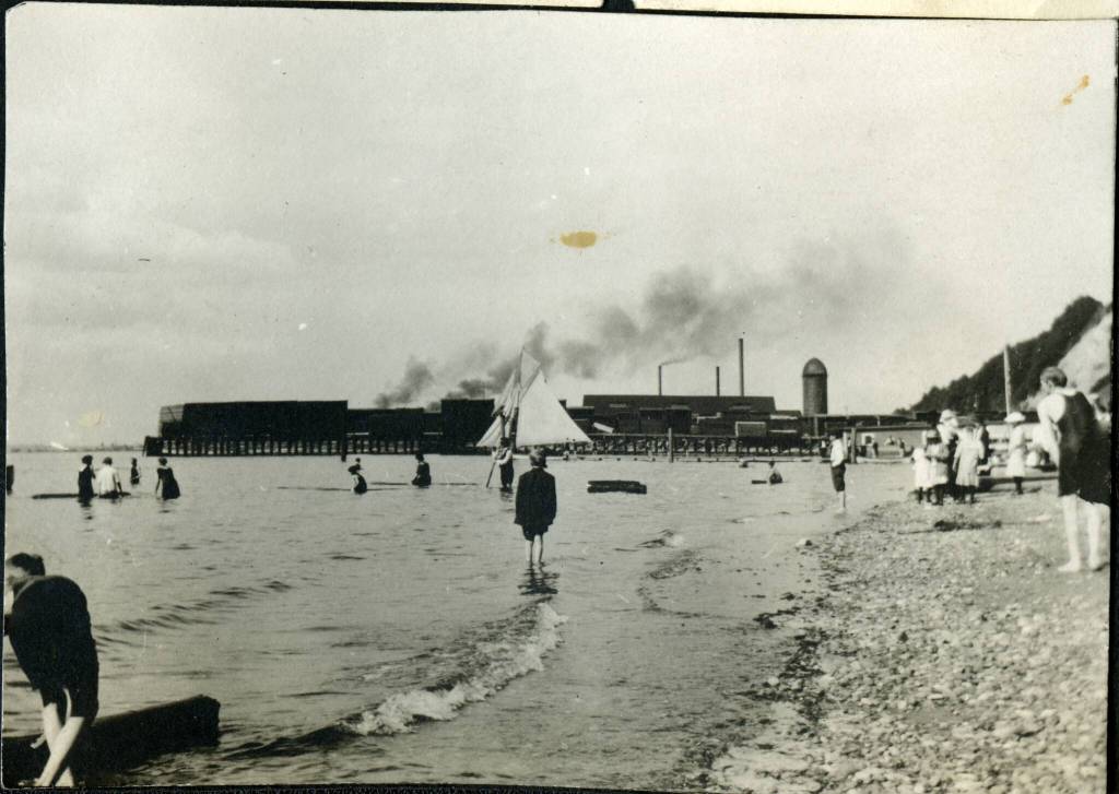 View from Junction Beach looking north. Weyerhaeuser Mill A in the background. Slope of Rucker Hill to the right. Photo from the Florence Bertrand album. (Provided by the Everett Public Library)