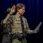 Snohomish County sheriff Susanna Johnson swears in colleagues during the ceremonial oath of office at the PUD auditorium in Everett, Washington on Tuesday, Jan. 2, 2024. (Annie Barker / The Herald)
