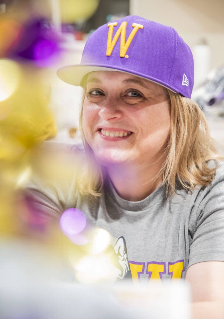 Andrea Ancich in her University of Washington gear at her home in Marysville. (Olivia Vanni / The Herald)