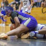 Lake Stevens Nisa Ellis scrambles for a loose ball during the game against Kamiak on Wednesday in Mukilteo. (Olivia Vanni / The Herald)