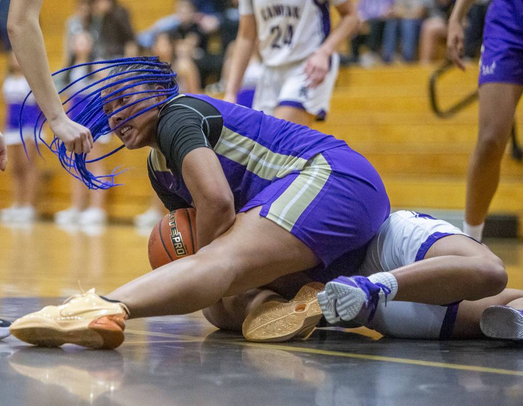Lake Stevens Nisa Ellis scrambles for a loose ball during the game against Kamiak on Wednesday in Mukilteo. (Olivia Vanni / The Herald)