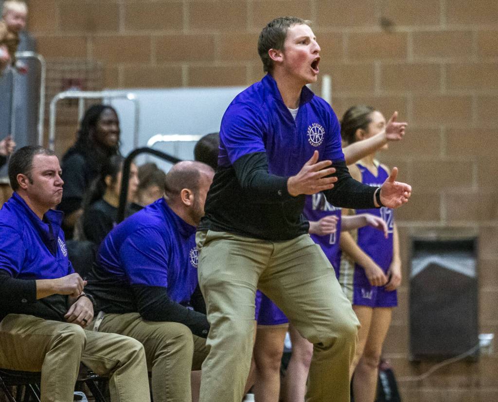 Lake Stevens head coach Seth Doge reacts to his team pulling ahead during the game that game Kamiak on Wednesday, Jan. 3, 2024 in Mukilteo, Washington. (Olivia Vanni / The Herald)