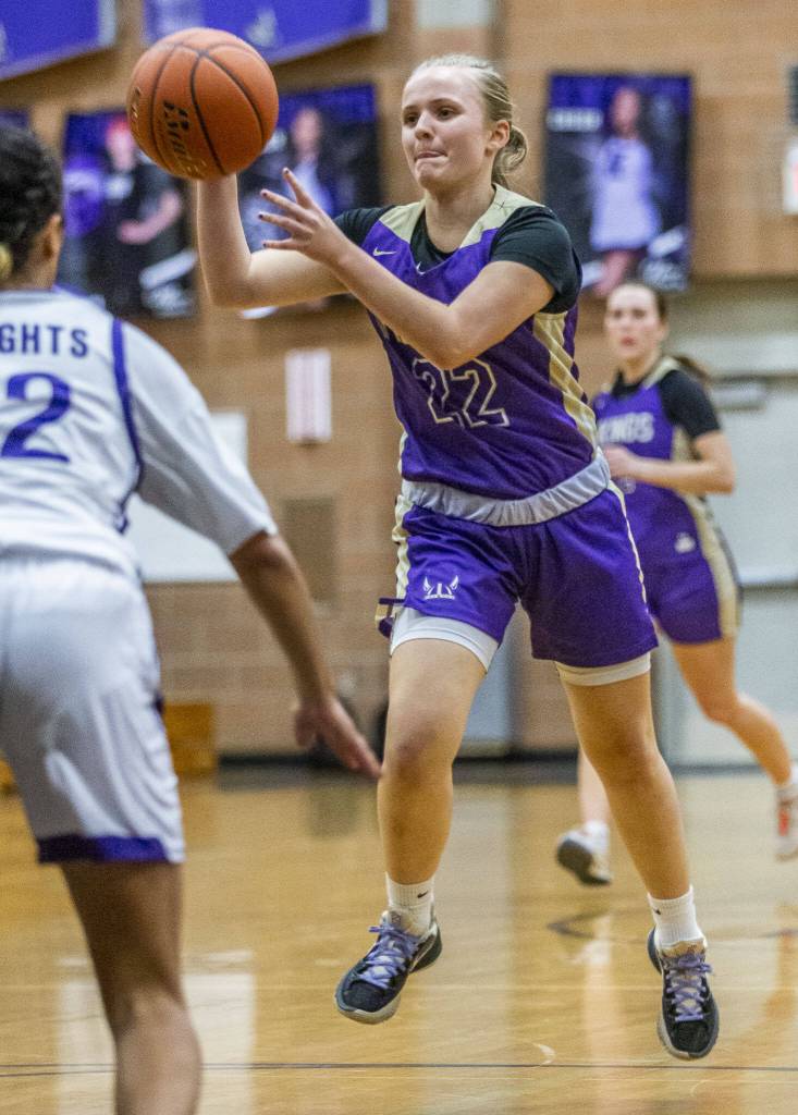 Lake Stevens Addy Baker jumps while making a pass during the game against Kamiak on Wednesday, Jan. 3, 2024 in Mukilteo, Washington. (Olivia Vanni / The Herald)