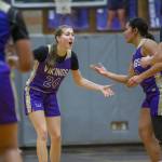 Lake Stevens Kamryn Wenz high fives her teammates during the game against Kamiak on Wednesday, Jan. 3, 2024 in Mukilteo, Washington. (Olivia Vanni / The Herald)