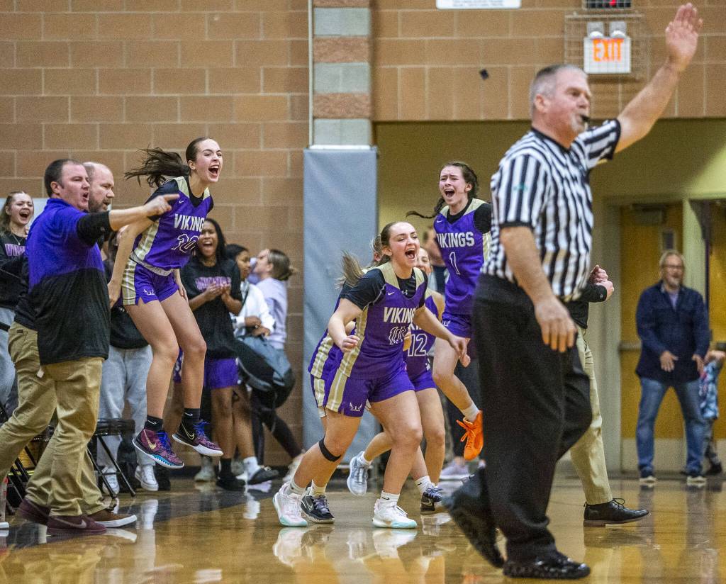 The Lake Stevens bench reacts to beating Kamiak on Wednesday, Jan. 3, 2024 in Mukilteo, Washington. (Olivia Vanni / The Herald)