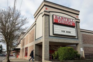 A person walks into Bartell Drugs along Broadway on Wednesday, Jan. 3, 2024 in Everett, Washington. (Olivia Vanni / The Herald)
