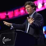 FILE - Tucker Carlson speaks at the Turning Point Action conference, Saturday, July 15, 2023, in West Palm Beach, Fla. Carlson, the ousted Fox News host, announced Monday, Dec. 11, that he is starting his own streaming service, promising to “tell the unadorned truth” to fans for $72 a year. (AP Photo/Lynne Sladky, File)