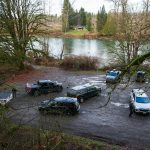 A large number off law enforcement are gathered at a Skykomish River water access on Ben Howard Road on Wednesday, Jan. 3, 2024, in Monroe, Washington. (Ryan Berry / The Herald)