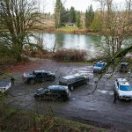 A large number off law enforcement are gathered at a Skykomish River water access on Ben Howard Road on Wednesday, Jan. 3, 2024, in Monroe, Washington. (Ryan Berry / The Herald)