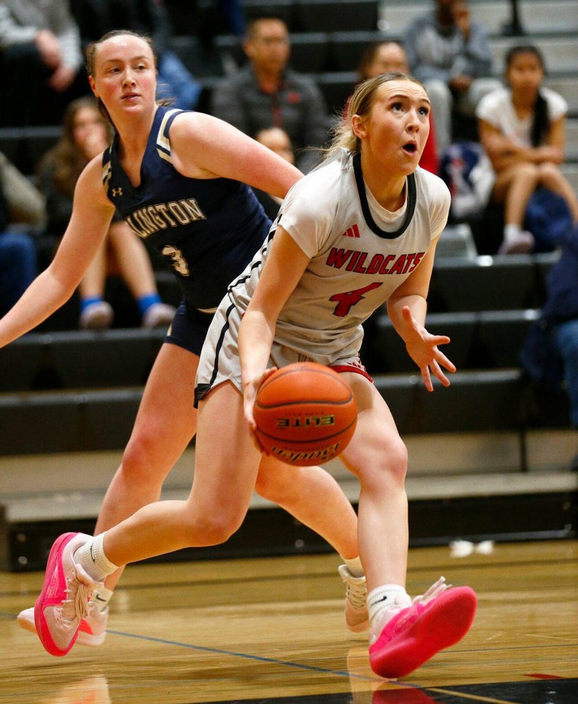 Archbishop Murphy junior guard Taylor Cushing dribbles down the baseline on her way for a layup against Arlington on Tuesday, Jan. 9, 2024, at Archbishop Murphy High School in Everett, Washington. (Ryan Berry / The Herald)