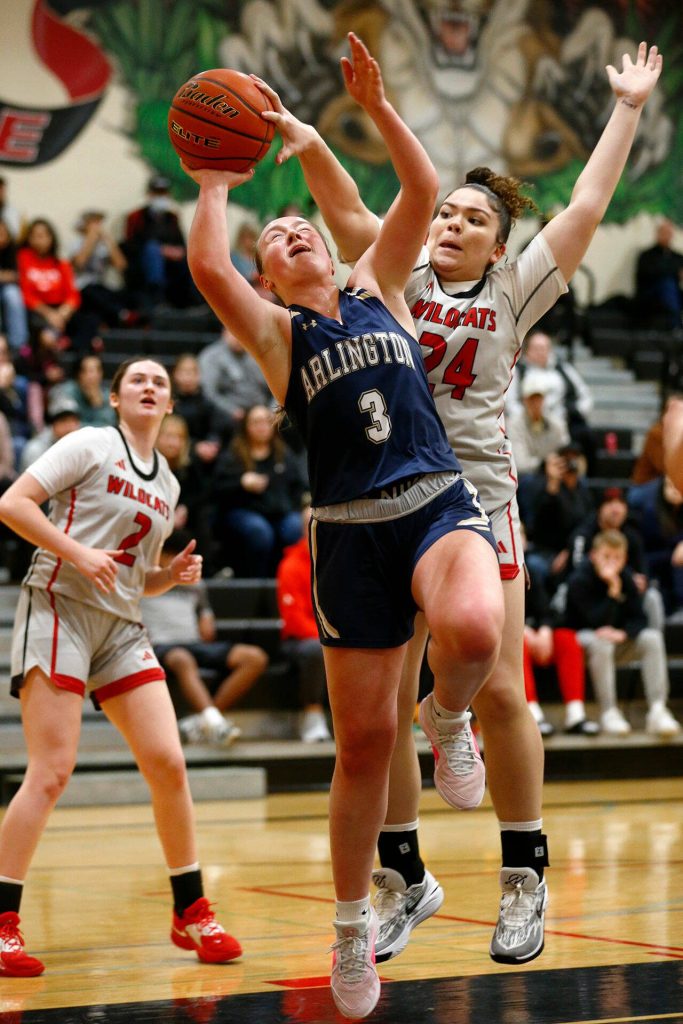 Arlingtons Rachel Snow tries to get off a shot through contact against Archbishop Murphy on Tuesday, Jan. 9, 2024, at Archbishop Murphy High School in Everett, Washington. (Ryan Berry / The Herald)