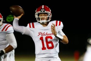 Marysville Pilchuck quarterback Luke Shoemaker steps into a pass after avoiding pressure against Marysville Getchell during the Berry Bowl on Friday, Sept. 15, 2023, at Quil Ceda Stadium in Marysville, Washington. The completion went for a long touchdown to receiver Dominik Kendrick. (Ryan Berry / The Herald)