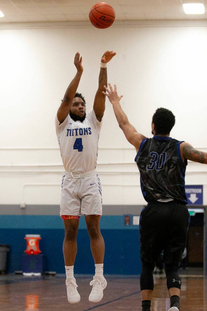 Edmonds Colleges Naser Motley shoots a 3-pointer during a matchup with Christian Faith on Jan. 4 at Seaview Gym in Lynnwood. (Ryan Berry / The Herald)