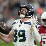 Seattle Seahawks tight end Will Dissly scores a touchdown against the Arizona Cardinals during a game Sunday in Glendale, Ariz. (AP Photo/Ross D. Franklin)