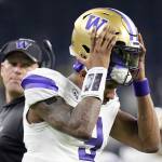 Washington quarterback Michael Penix Jr. leaves field at the end of the first half against Michigan during the national championship game Monday in Houston. (AP Photo/Eric Gay)