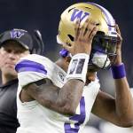 Washington quarterback Michael Penix Jr. leaves field at the end of the half against Michigan of the national championship NCAA College Football Playoff game Monday, Jan. 8, 2024, in Houston. (AP Photo/Eric Gay)