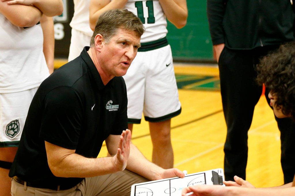 Jackson head coach Steve Johnson speaks with his team between quarters during a game against Glacier Peak on Wednesday, Jan. 10, 2024, at Henry M. Jackson High School in Mill Creek, Washington. (Ryan Berry / The Herald)
