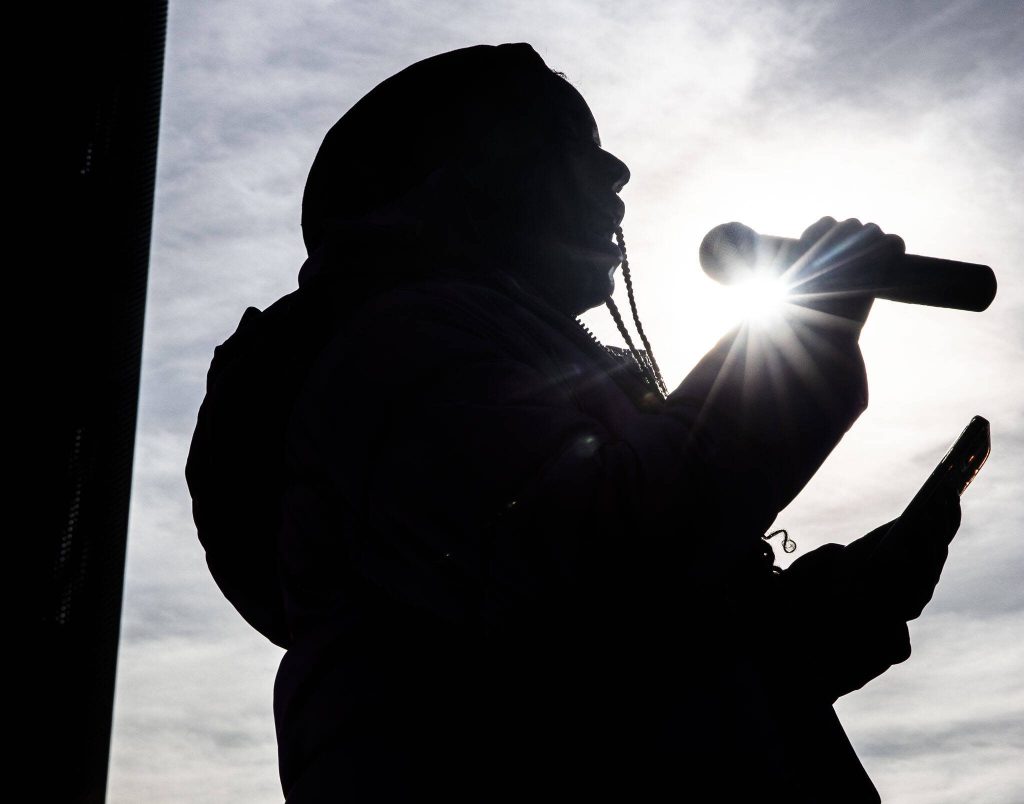 JaQyrie Wheeler sings before the start of Snohomish County Black Heritage Committees annual Martin Luther King Jr. Day march on Monday, Jan. 15, 2024 in Everett, Washington. (Olivia Vanni / The Herald)