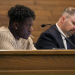 City council member Josh Binda listens and eats a sucker during a city council meeting at Lynnwood City Hall in Lynnwood, Washington on Monday, Jan. 23, 2023. (Annie Barker / The Herald)