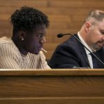 City council member Josh Binda listens and eats a sucker during a city council meeting at Lynnwood City Hall in Lynnwood, Washington on Monday, Jan. 23, 2023. (Annie Barker / The Herald)