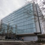 A person walks out of the Snohomish County Corrections building on Wednesday, Jan. 3, 2024 in Everett, Washington. (Olivia Vanni / The Herald)