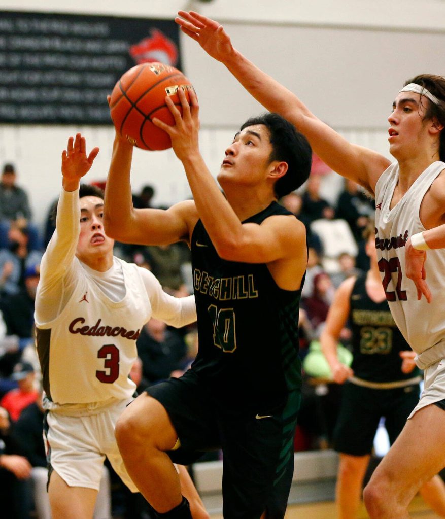 Marysville Getchells Bubba Palocol finishes a fast break at the rim against Cedarcrest on Tuesday, Jan. 16, 2024, at Cedarcrest High School in Duvall, Washington. (Ryan Berry / The Herald)