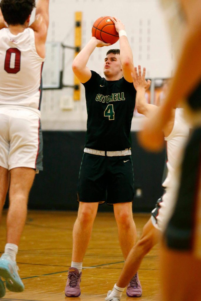 Marysville Getchells Wyatt Harris shoots a three against Cedarcrest on Tuesday, Jan. 16, 2024, at Cedarcrest High School in Duvall, Washington. (Ryan Berry / The Herald)