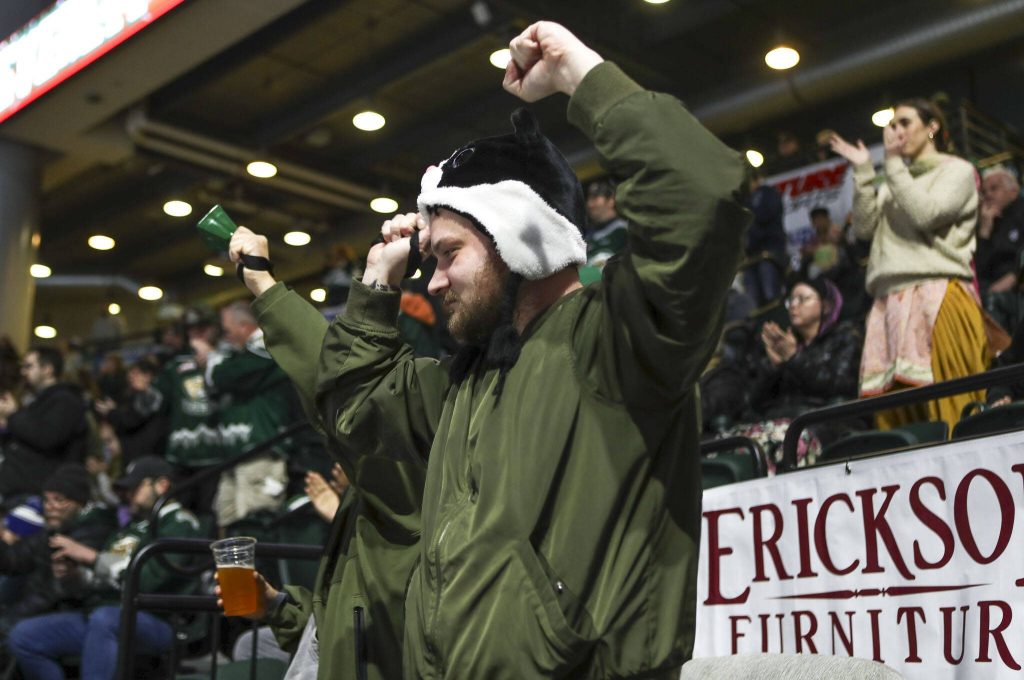 Fans celebrate a goal during a game between the Everett Silvertips and Tri-City Americans at the Angel of the Winds Arena on Sunday, Jan. 21, 2024. The Silvertips won, 5-3. (Annie Barker / The Herald)