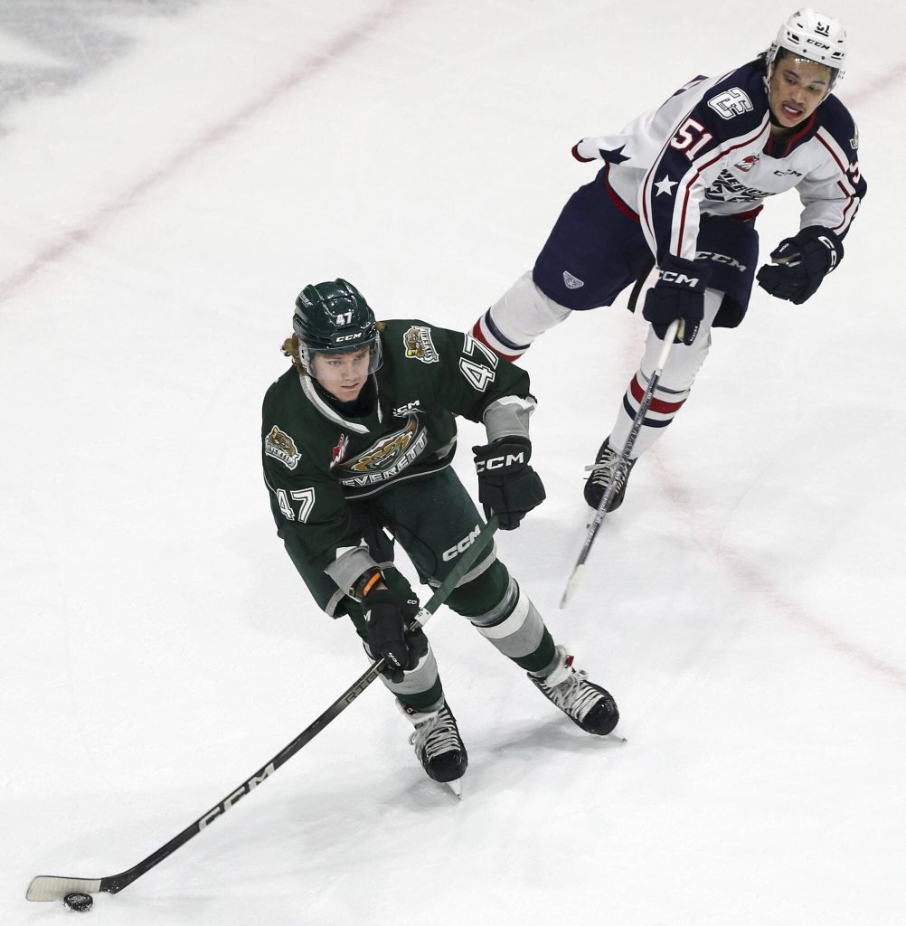 Silvertips Kaden Hammell (47) fights for the puck during a game between the Everett Silvertips and Tri-City Americans at the Angel of the Winds Arena on Sunday, Jan. 21, 2024. The Silvertips won, 5-3. (Annie Barker / The Herald)