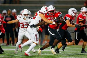 Mountlake Terrace’s Zaveon Jones sheds a defender after taking a handoff against Snohomish on Friday, Sept. 8, 2023, at Edmonds Stadium in Edmonds, Washington. (Ryan Berry / The Herald)